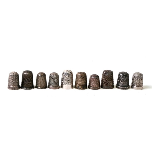 947 - A group of silver and white metal thimbles (10).