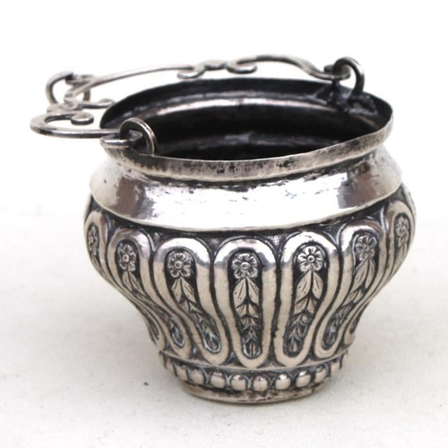 949 - An Italian embossed silver Holy Water bucket with swing handle, overall 13cms (5ins) high.