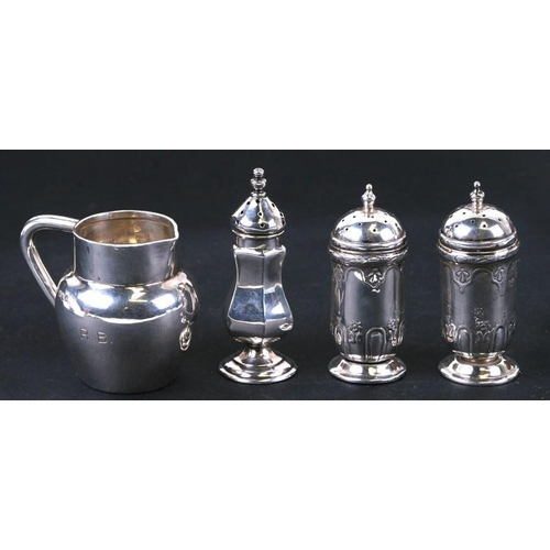 951 - An Edwardian silver three-piece condiment set with repousse decoration, London 1906, weight 63.5g; t... 