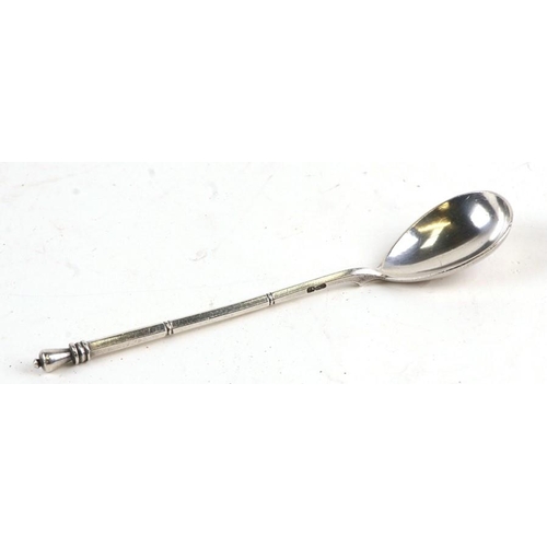 954 - A Russian silver teaspoon, 14cms (5.5ins) long.