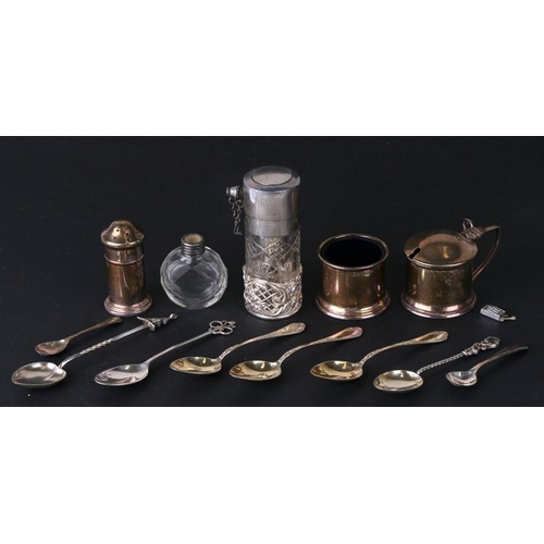 962 - A silver three piece cruet set, a quantity of silver spoons, a scent bottle and other items