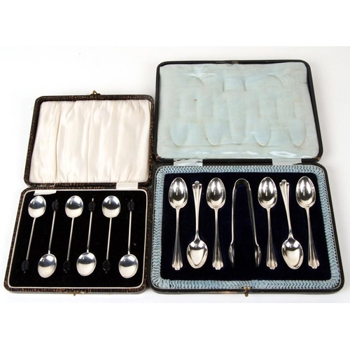 977 - A cased set of ornate silver teaspoons together with a set of bean terminal silver coffee spoons