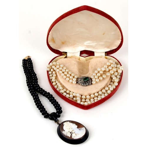 994 - A three-strand faux pearl necklace with silver clasp; together with a cameo pendant on a black bead ... 