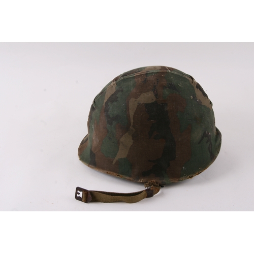 1052 - A Vietnam War period USA military helmet.