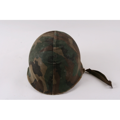 1052 - A Vietnam War period USA military helmet.