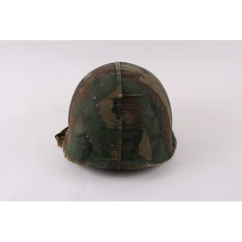 1052 - A Vietnam War period USA military helmet.