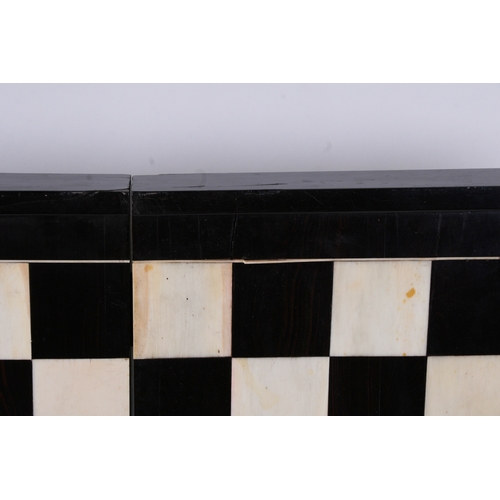 650 - An ebony and ivory folding backgammon/ chess board. 46cm (18ins) wide