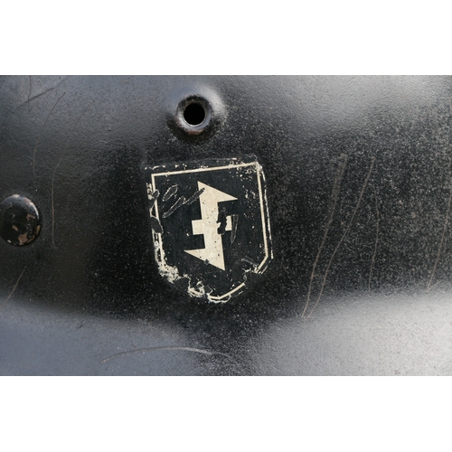 291 - A WW2 Third Reich Nazi M1940 double decal helmet with liner and chin strap. Marked on inside ET 64 a... 