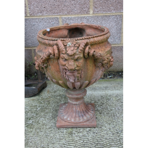 7 - A terracotta urn of classical form, approximately 46cms (18ins) diameter.