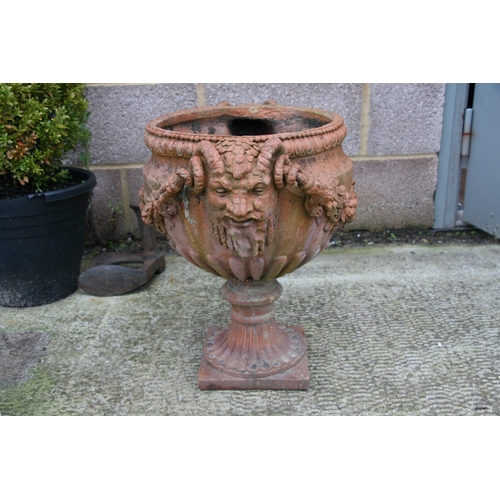 7 - A terracotta urn of classical form, approximately 46cms (18ins) diameter.