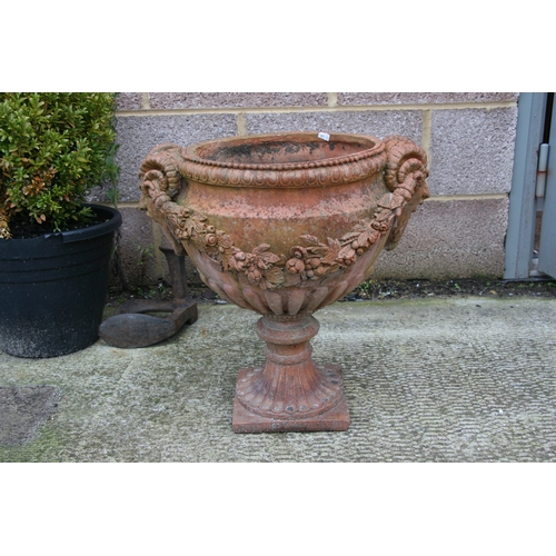 7 - A terracotta urn of classical form, approximately 46cms (18ins) diameter.