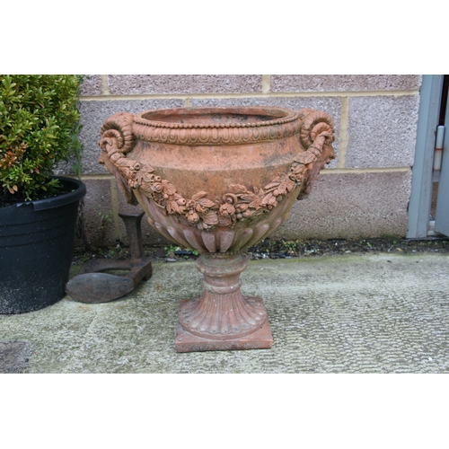 7 - A terracotta urn of classical form, approximately 46cms (18ins) diameter.