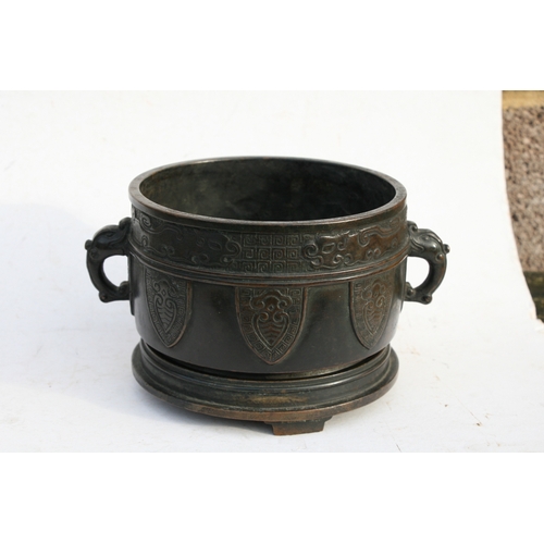 519 - A Chinese bronze two-handled censer on stand with six character mark to the underside, 16cms (6.25in... 