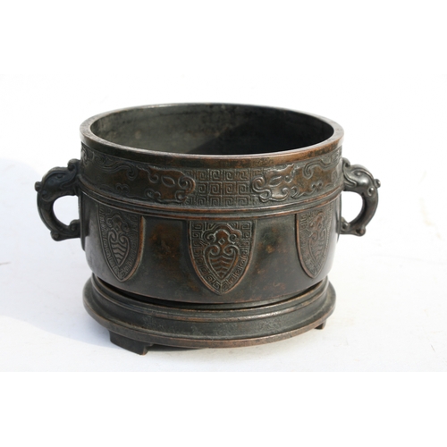 519 - A Chinese bronze two-handled censer on stand with six character mark to the underside, 16cms (6.25in... 