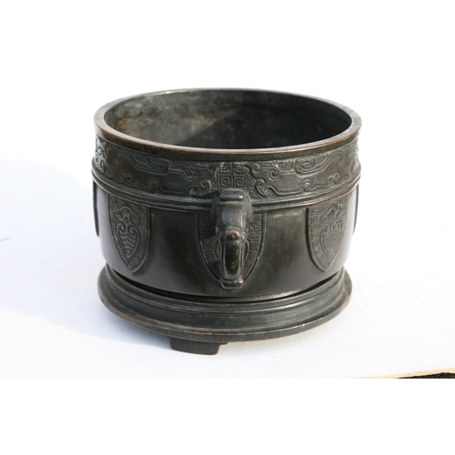 519 - A Chinese bronze two-handled censer on stand with six character mark to the underside, 16cms (6.25in... 