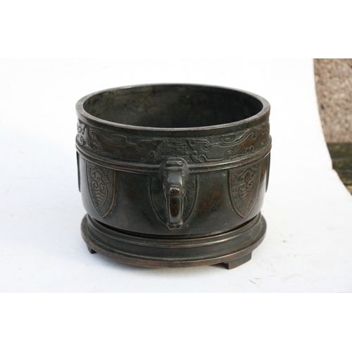 519 - A Chinese bronze two-handled censer on stand with six character mark to the underside, 16cms (6.25in... 