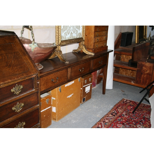 742 - An oak dresser base with three frieze drawers, on square tapering legs, 181cms (71.5ins) wide.