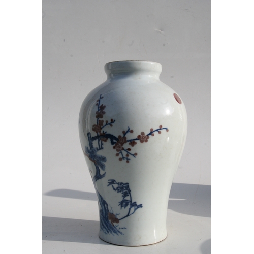 515 - A Chinese blue & copper red baluster vase decorated with a landscape scene, six character mark to th... 