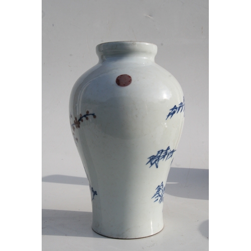 515 - A Chinese blue & copper red baluster vase decorated with a landscape scene, six character mark to th... 