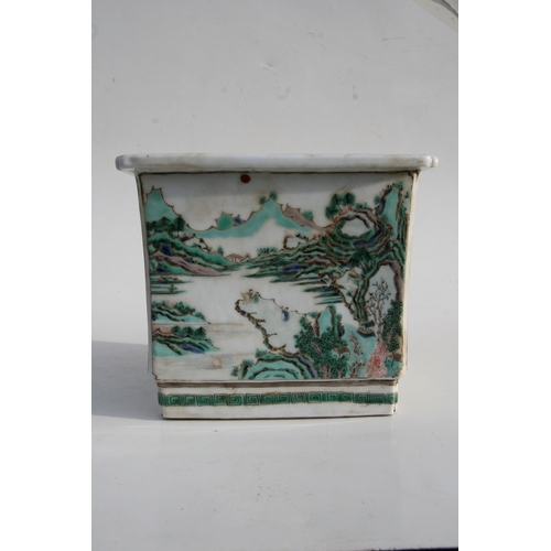 503 - A Chinese famille rose square form planter decorated with landscape scenes, 24cms (9.5ins) wide.