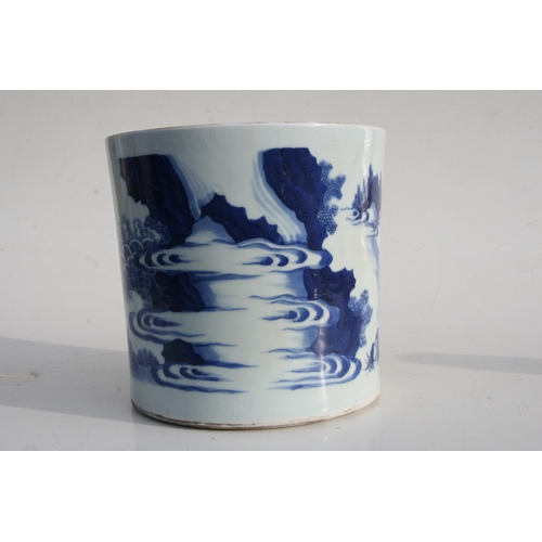 379 - A large Chinese blue & white brush pot decorated with figures in a landscape, 20cms (8ins) high.