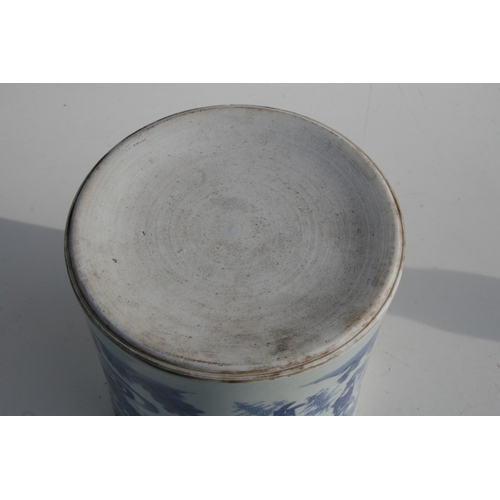 379 - A large Chinese blue & white brush pot decorated with figures in a landscape, 20cms (8ins) high.