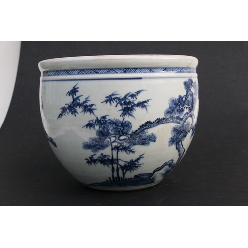 517 - A Chinese blue & white 'Three Friends' pattern planter, 19cms (7.5ins) high.