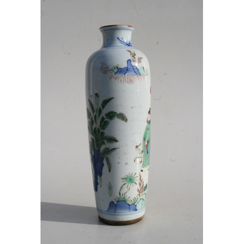 518 - A Chinese famille rose vase decorated with figures in a landscape, 25cms (9.75ins) high.