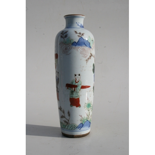 518 - A Chinese famille rose vase decorated with figures in a landscape, 25cms (9.75ins) high.