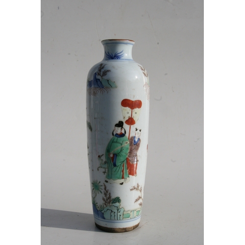 518 - A Chinese famille rose vase decorated with figures in a landscape, 25cms (9.75ins) high.