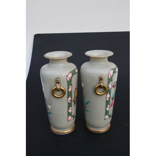 22 - A pair of French opaline glass vases decorated in the Chinese manner with figures. 25cm ( 9.75 ins) ... 