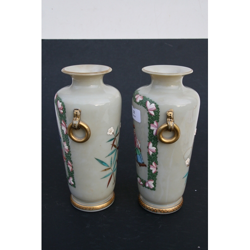 22 - A pair of French opaline glass vases decorated in the Chinese manner with figures. 25cm ( 9.75 ins) ... 