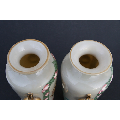 22 - A pair of French opaline glass vases decorated in the Chinese manner with figures. 25cm ( 9.75 ins) ... 