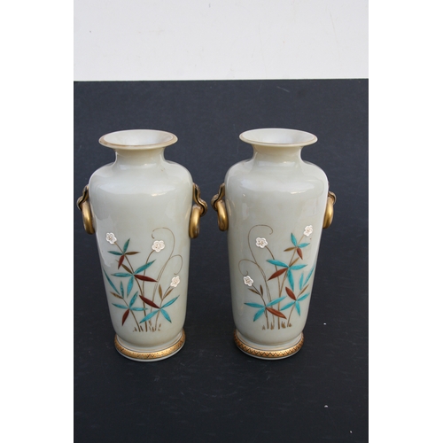 22 - A pair of French opaline glass vases decorated in the Chinese manner with figures. 25cm ( 9.75 ins) ... 