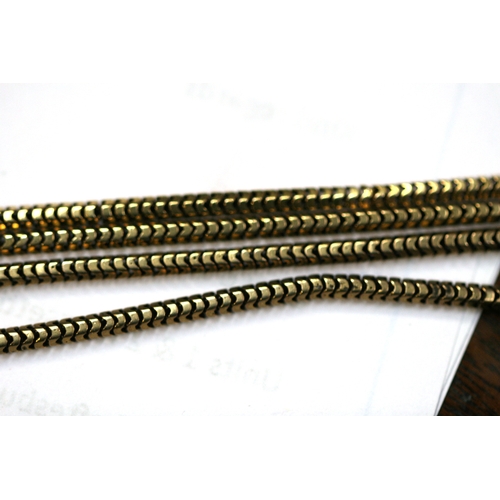 215 - A yellow metal (test as gold) snake skin link guard chain. Total length 168cm (66 ins).   36.8g