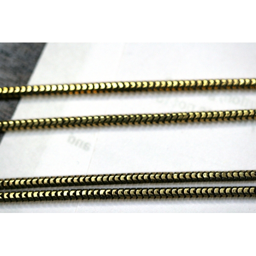 215 - A yellow metal (test as gold) snake skin link guard chain. Total length 168cm (66 ins).   36.8g