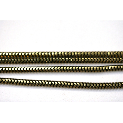 215 - A yellow metal (test as gold) snake skin link guard chain. Total length 168cm (66 ins).   36.8g