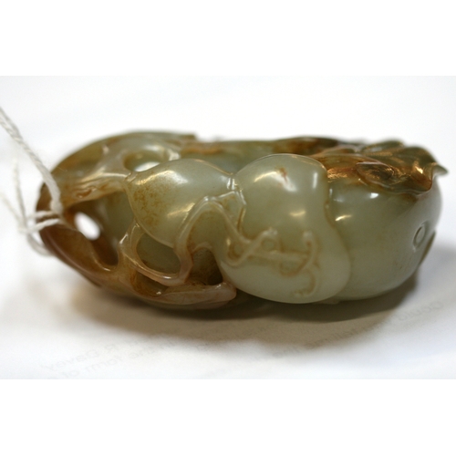 456 - A Chinese jade carving depicting gourds and foliage, 7cms (2.75ins) high.