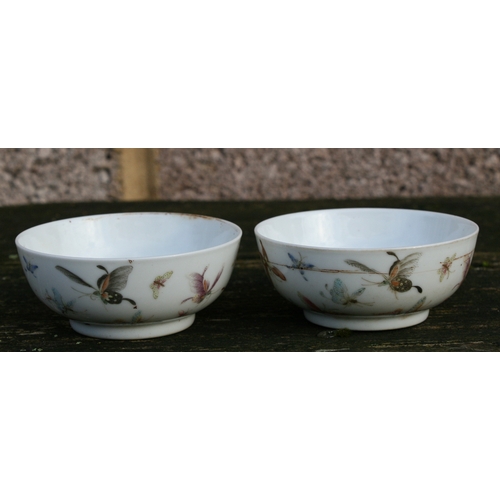 524 - A pair of Chinese porcelain wine cups decorated with butterflies, four character red mark to the und... 