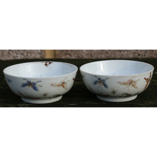 524 - A pair of Chinese porcelain wine cups decorated with butterflies, four character red mark to the und... 