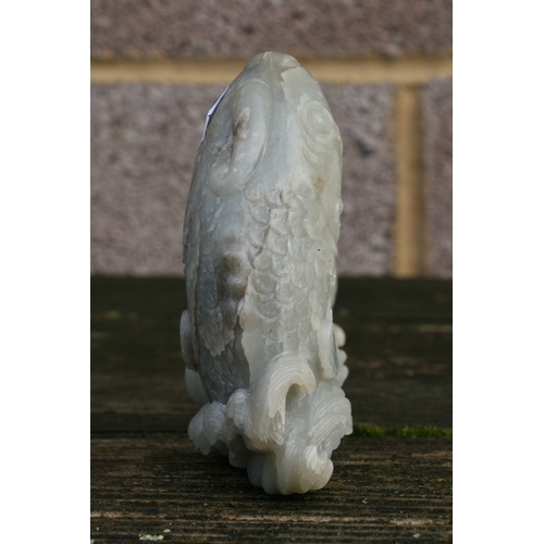 504 - A Chinese jade / hardstone boulder carved in the form of a stylised fish, 14cms (5.5ins) high.