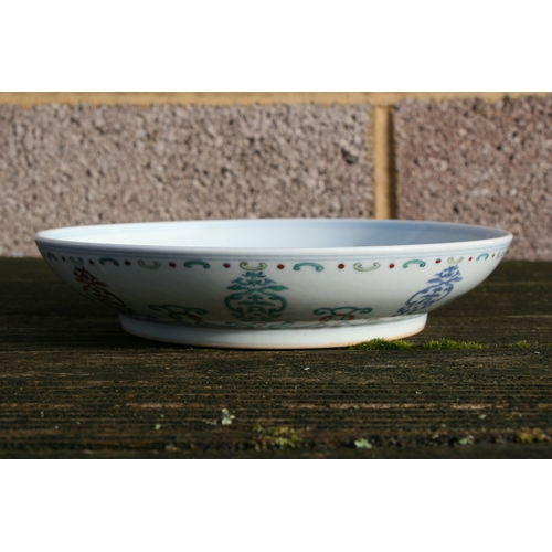 493 - A Chinese Ducai shallow footed bowl decorated with foliate scrolls, blue seal mark to the underside ... 