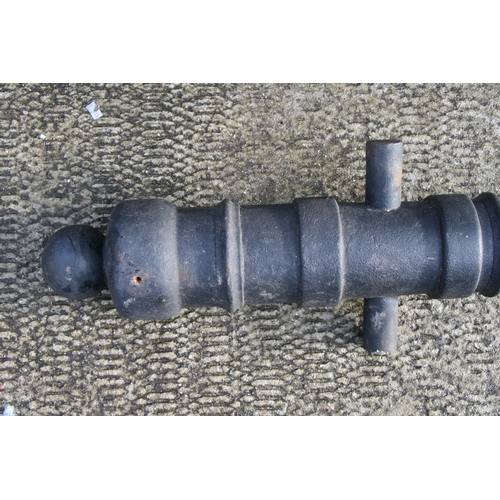 351 - A full size Cannon, having a cast iron barrel 84cms (33ins) long with an approximate Bore Diameter o... 