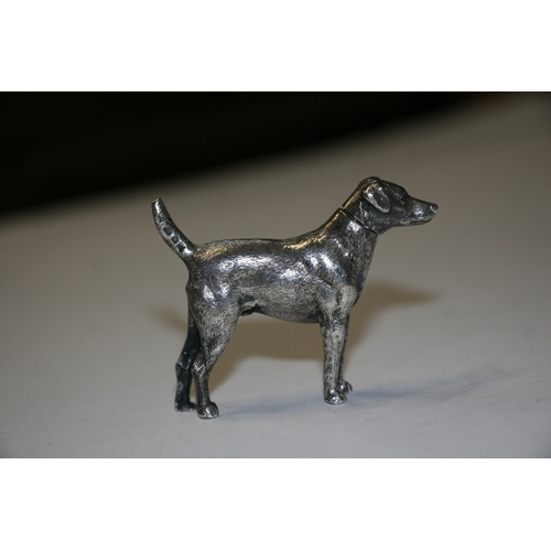 174 - A novelty silver pepper caster in the form of a standing hound, maker's mark for William Comyns & So... 