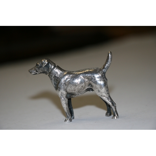 174 - A novelty silver pepper caster in the form of a standing hound, maker's mark for William Comyns & So... 