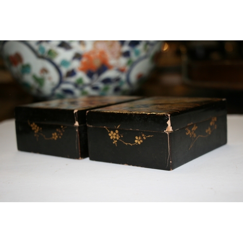 369 - A set of Japanese lacquered boxes with gilt decoration on a black ground (5).