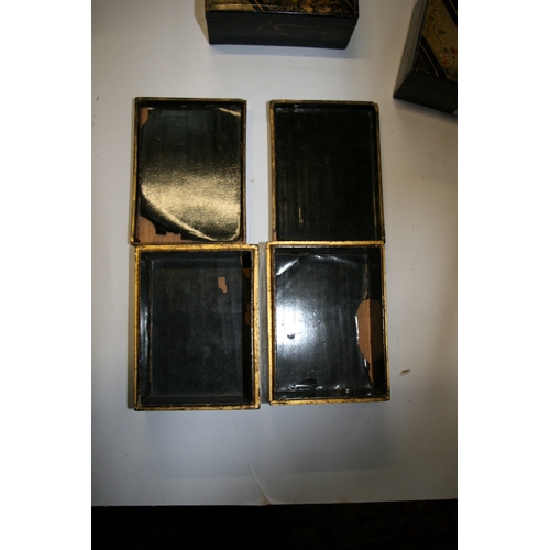 369 - A set of Japanese lacquered boxes with gilt decoration on a black ground (5).