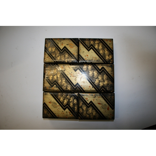 369 - A set of Japanese lacquered boxes with gilt decoration on a black ground (5).