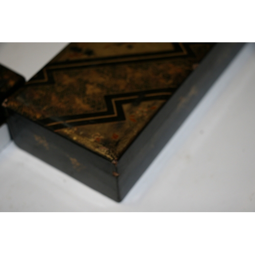 369 - A set of Japanese lacquered boxes with gilt decoration on a black ground (5).