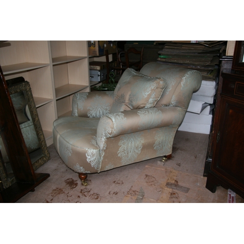 796 - A Howard style silk upholstered armchair.